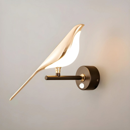 Gold magpie wall light with motion detector functionality, hanging on a beige wall