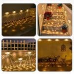 4 different decors in 4 square vignettes. top left, terrace with 4 solar wall lights fixed to a wall, top right, staircase with flower pots and solar wall lights on the left and right walls, bottom left, bottom left, outside wall with fence above and 3 solar wall lights fixed to the wall, bottom right, terrace with a table and 2 chairs, flower pots at the back and wall with 4 solar wall lights above on the wall.