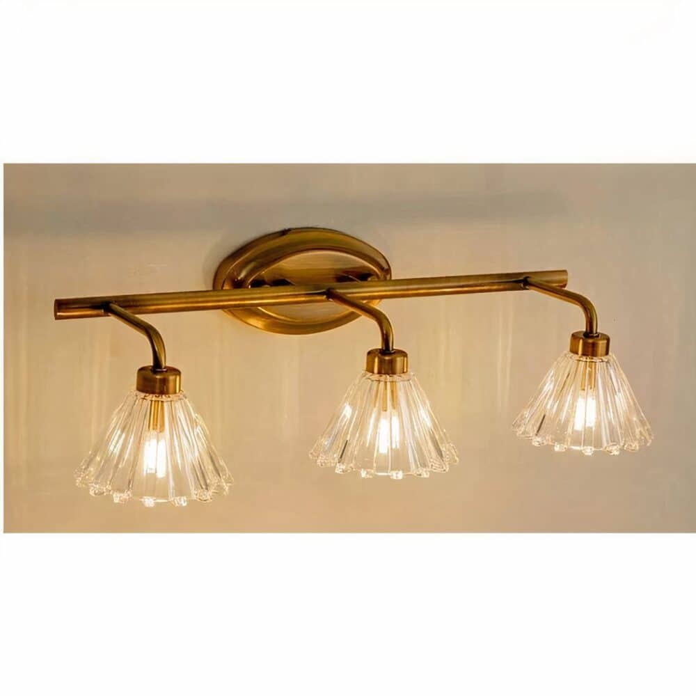 we see a three-headed wall sconce in classic style on a light wall