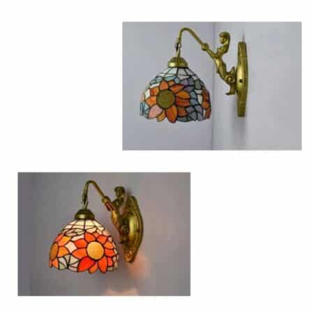 on a light grey mmur, a Tiffany-style wall light with floral motif is seen on the wall