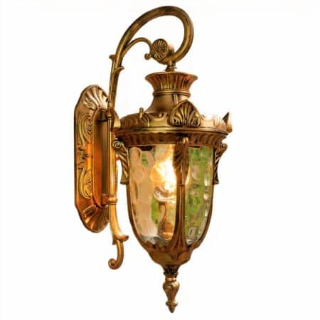 Vintage-style wall sconce in bronze-brown metal. Oval bracket with looped stem. Hanging lamp in the same color. It is formed on 4 sides with a glass panel revealing the lit bulb. White background.