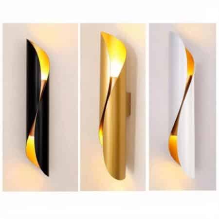 we see 3 minimalist and modern wall sconces one black white and gold