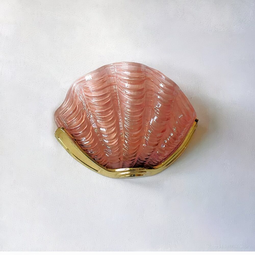 a pink or white seashell-shaped wall sconce can be seen on a light grey wall