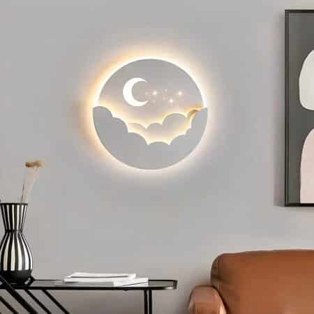 a cloud and white moon-shaped wall light is seen in a living room