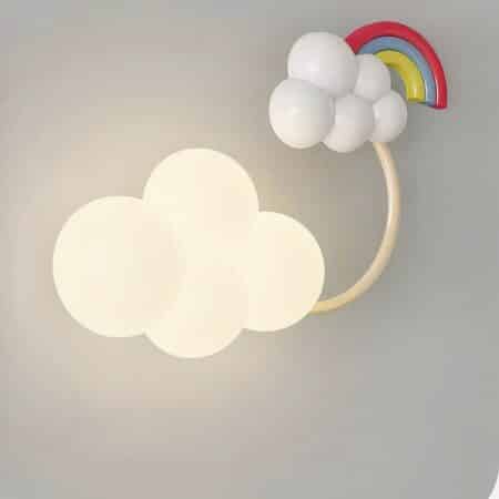 we see a cloud-shaped wall sconce with a rainbow on a light gray background