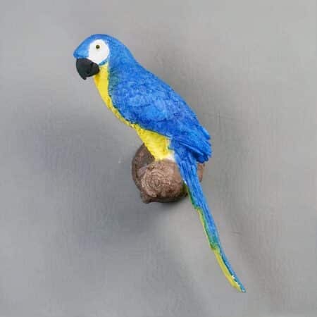 a blue parrot-shaped wall sconce can be seen on a light grey wall