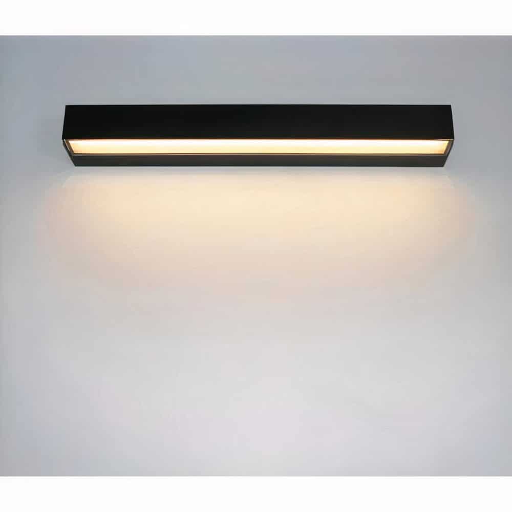 on a light gray wall, a black horizontal wall sconce for outdoor use