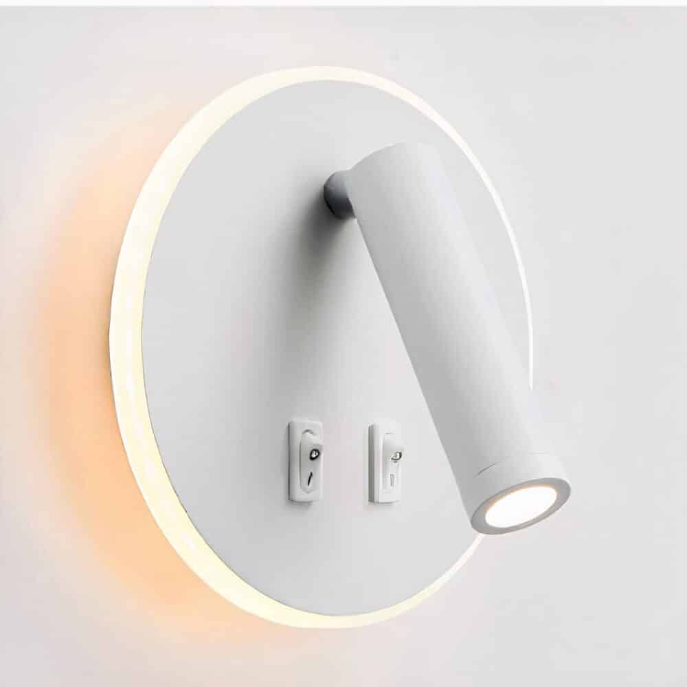 Round white wall reading light with contour lighting, one down-lighting tube and 2 switches.