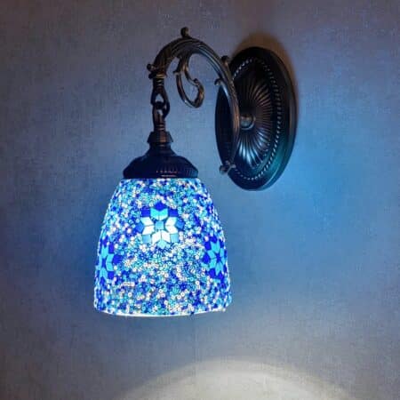 A blue oriental-style mosaic wall sconce